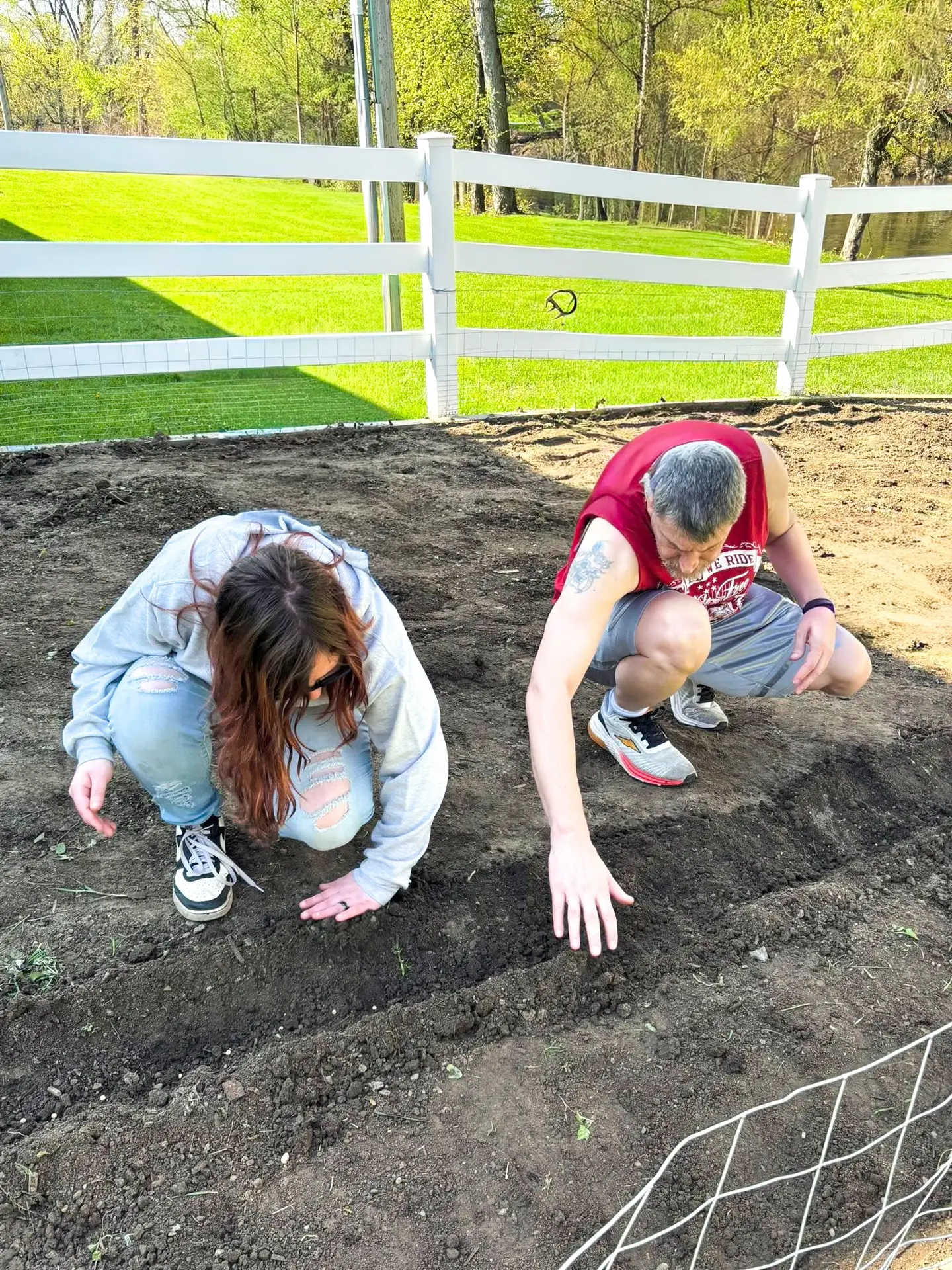 two people gardening