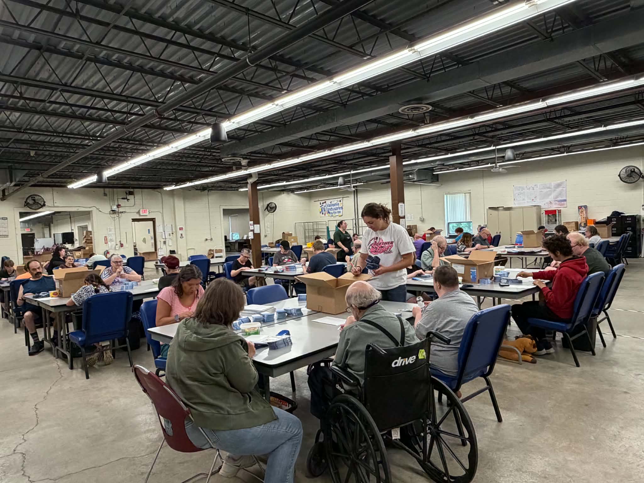 individuals working in the Production Floor Wide Angle
