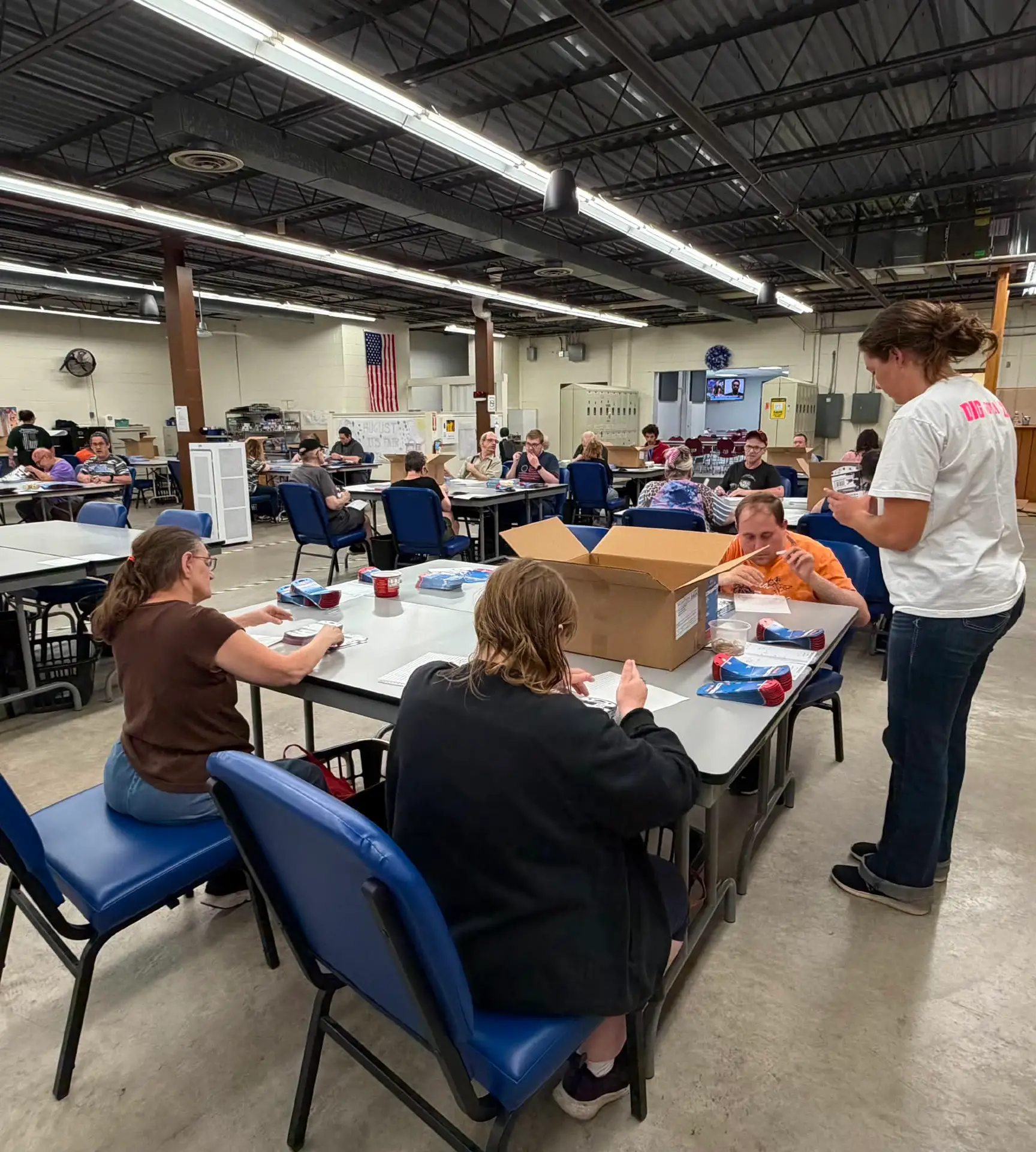 individuals working in the Production Floor Wide Angle