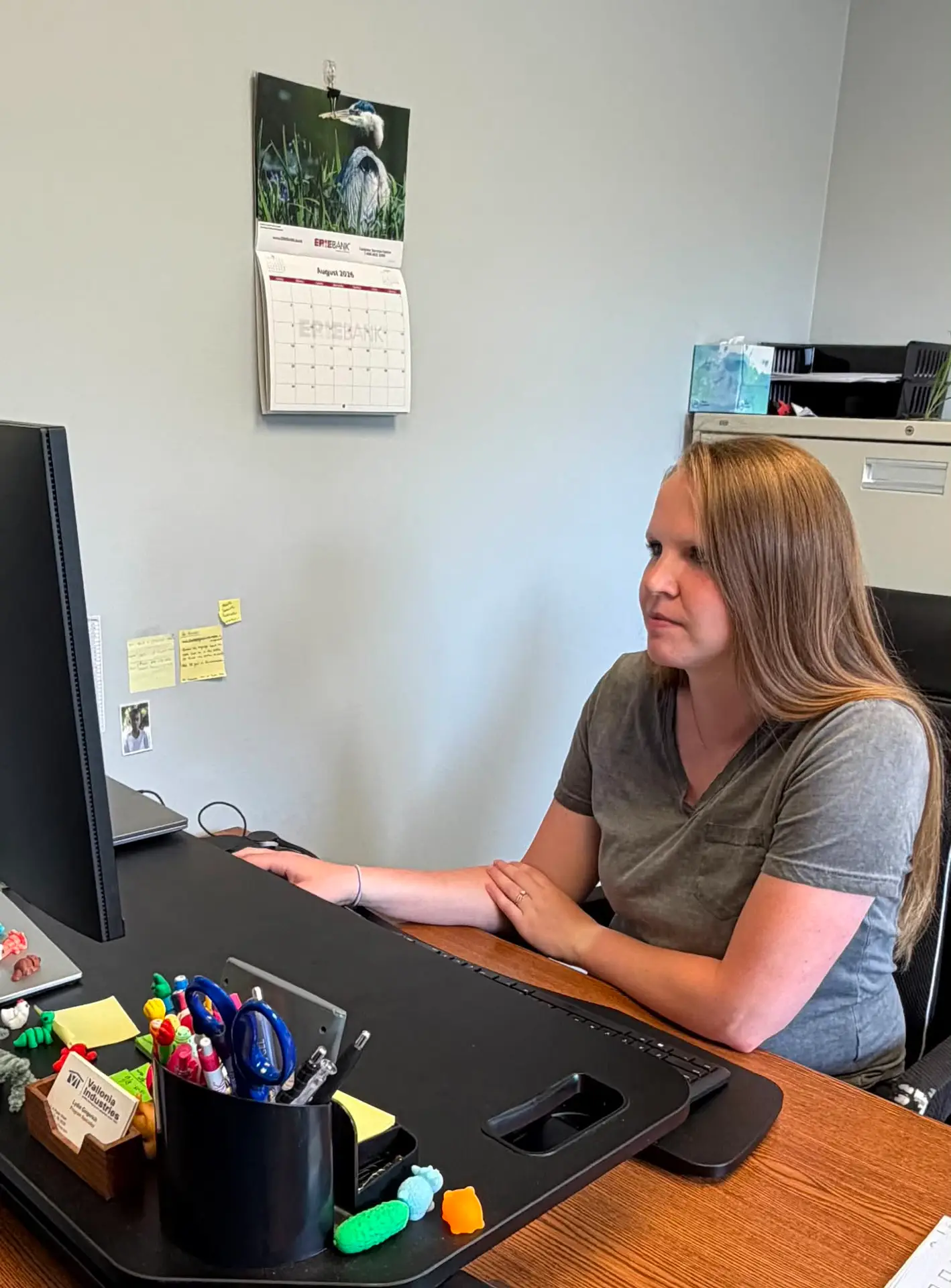 Program Specialist at desk